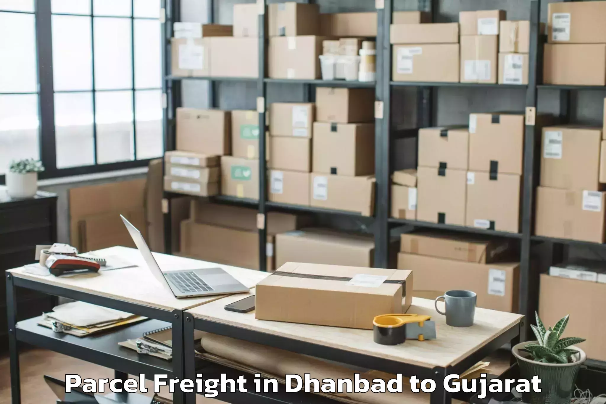 Top Dhanbad to Balasinor Parcel Freight Available